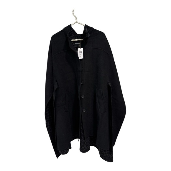 Coach Double Face Wool Cape
Comparable Value
$798 size XS-S oversized NWT - Picture 6 of 8